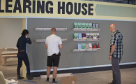 Kione, Kristian and Marc installing shelves